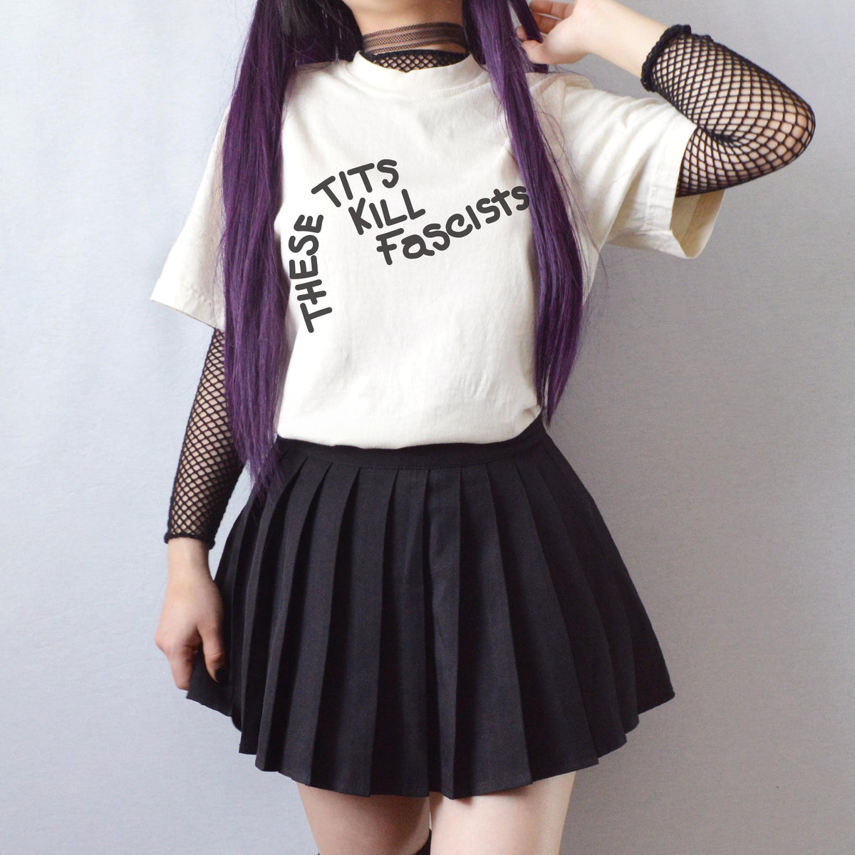 These Tits Kill Fascists graphic shirt featuring Feminist Anti-Fascist