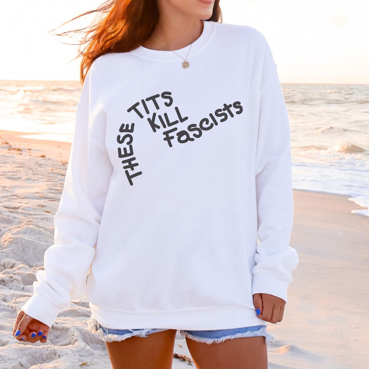 These Tits Kill Fascists graphic sweatshirt featuring Feminist Anti-Fascist