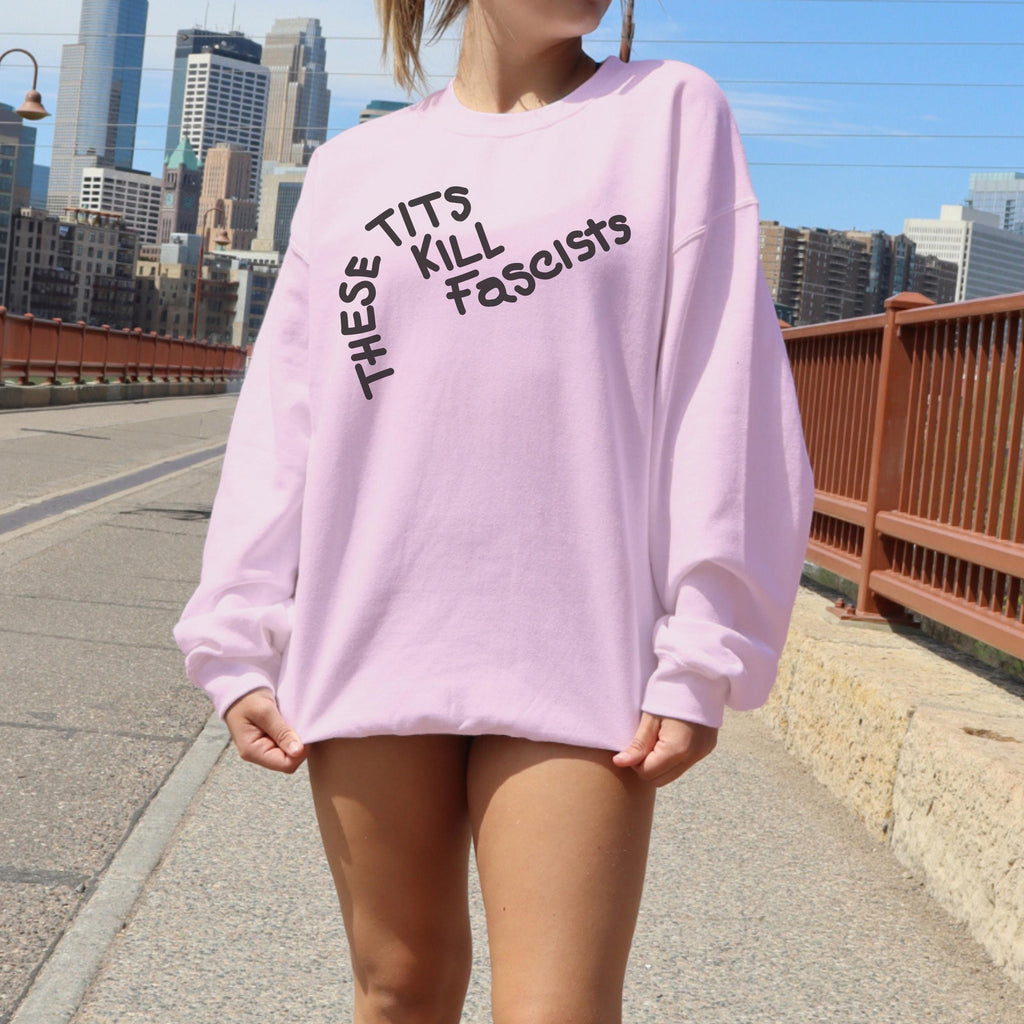 These Tits Kill Fascists graphic sweatshirt featuring Feminist Anti-Fascist