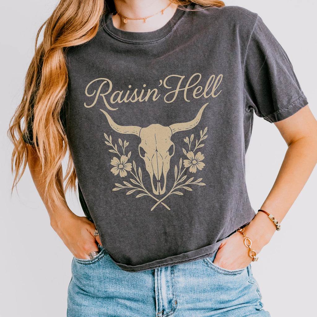 Product photo of Raisin’ Hell — Western Cow Skull Floral Design T-shirt