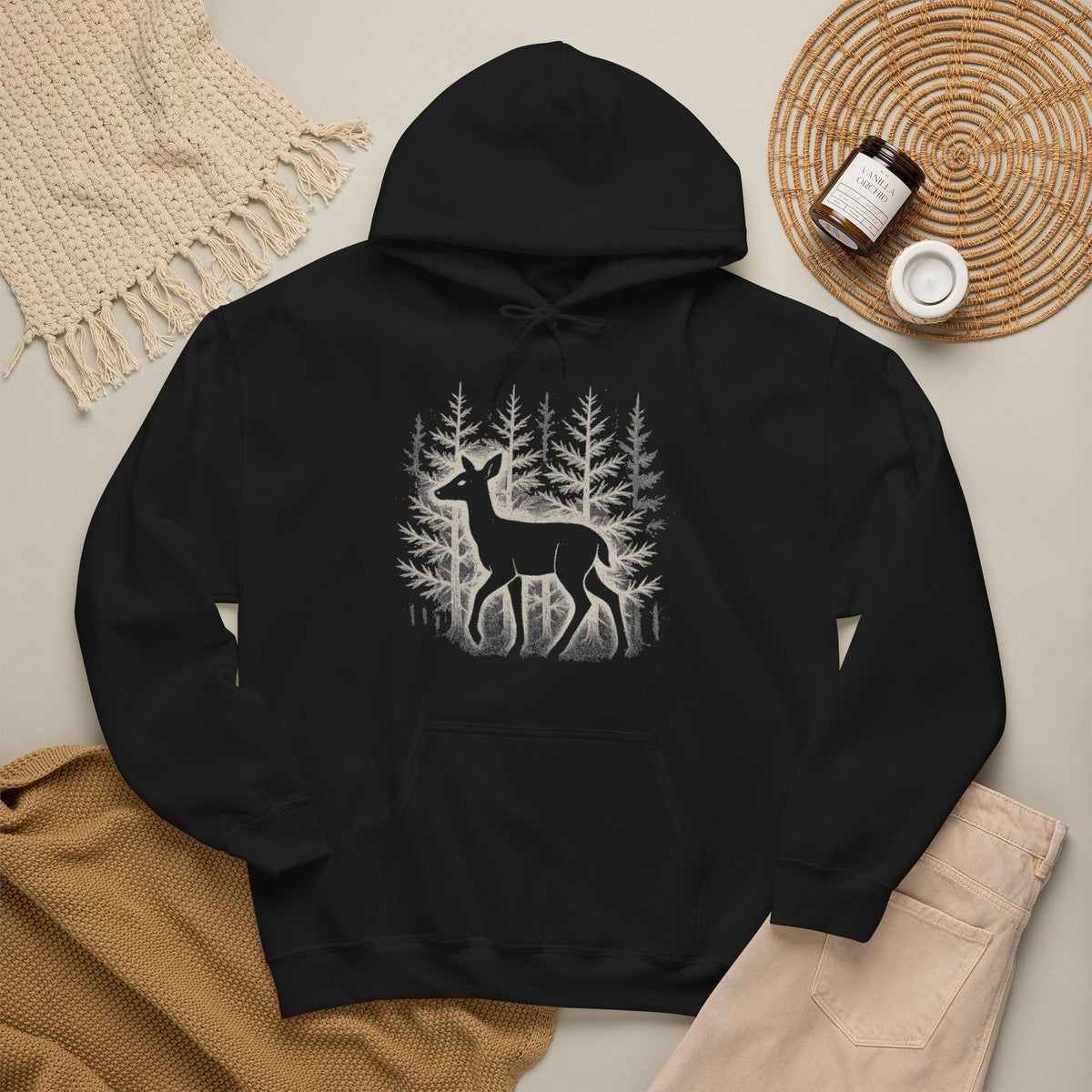 The Faithful Familiar black pullover hoodie featuring a white deer silhouette and forest graphic with kangaroo pocket.