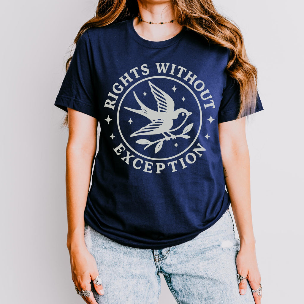 The Faithful Familiar unisex graphic tee in dark blue with a cream swallow and star emblem print.