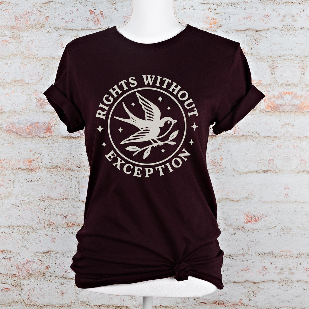 The Faithful Familiar unisex dark green graphic tee with a cream swallow and Rights Without Exception emblem print.