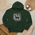 The Faithful Familiar forest green pullover hoodie featuring a white deer and pine tree graphic on the front.
