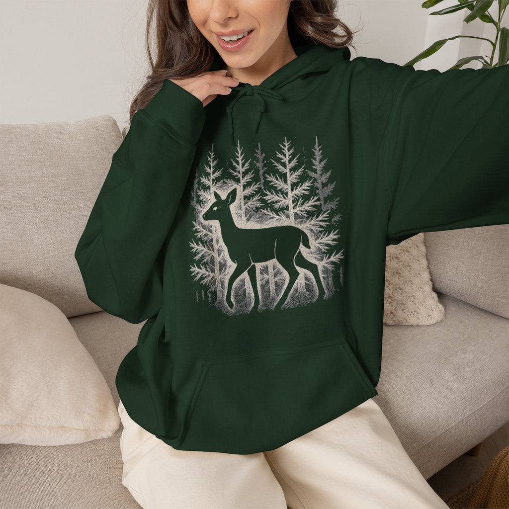 The Faithful Familiar forest green pullover hoodie featuring a white deer silhouette graphic in a snowy pine forest.