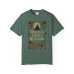 The Faithful Familiar garment-dyed green cotton t-shirt featuring a gothic castle, floral, and bookish graphic print.