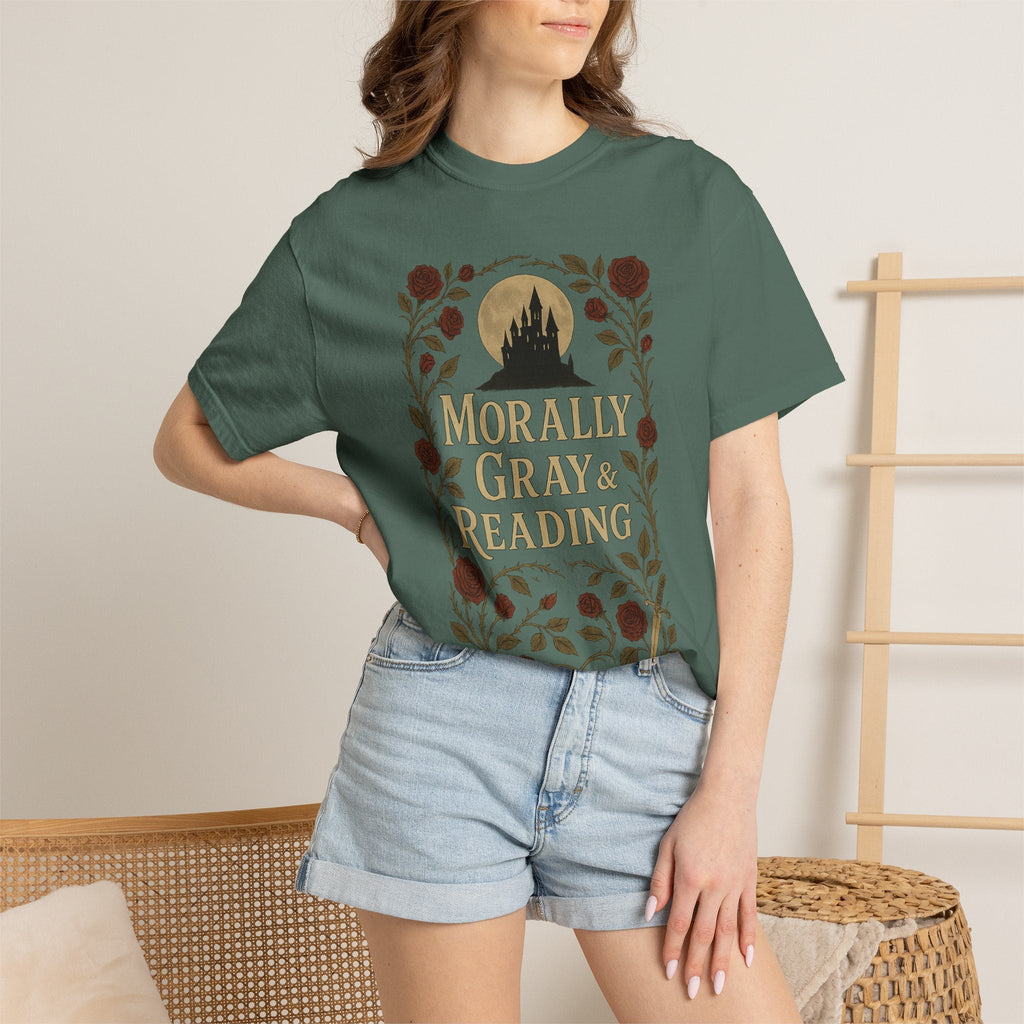 The Faithful Familiar garment-dyed green cotton t-shirt featuring a gothic castle, floral crest, and bookish text.