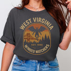 The Faithful Familiar charcoal Comfort Colors t-shirt with a vintage Mothman graphic in mustard and rust tones.