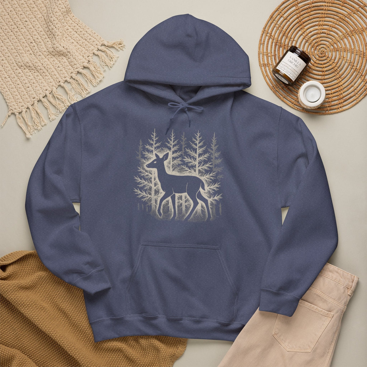 The Faithful Familiar navy blue pullover hoodie featuring a white deer silhouette graphic in a snowy forest setting.