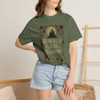 The Faithful Familiar olive green cotton graphic tee featuring a gothic castle, moon, and floral vine illustration.